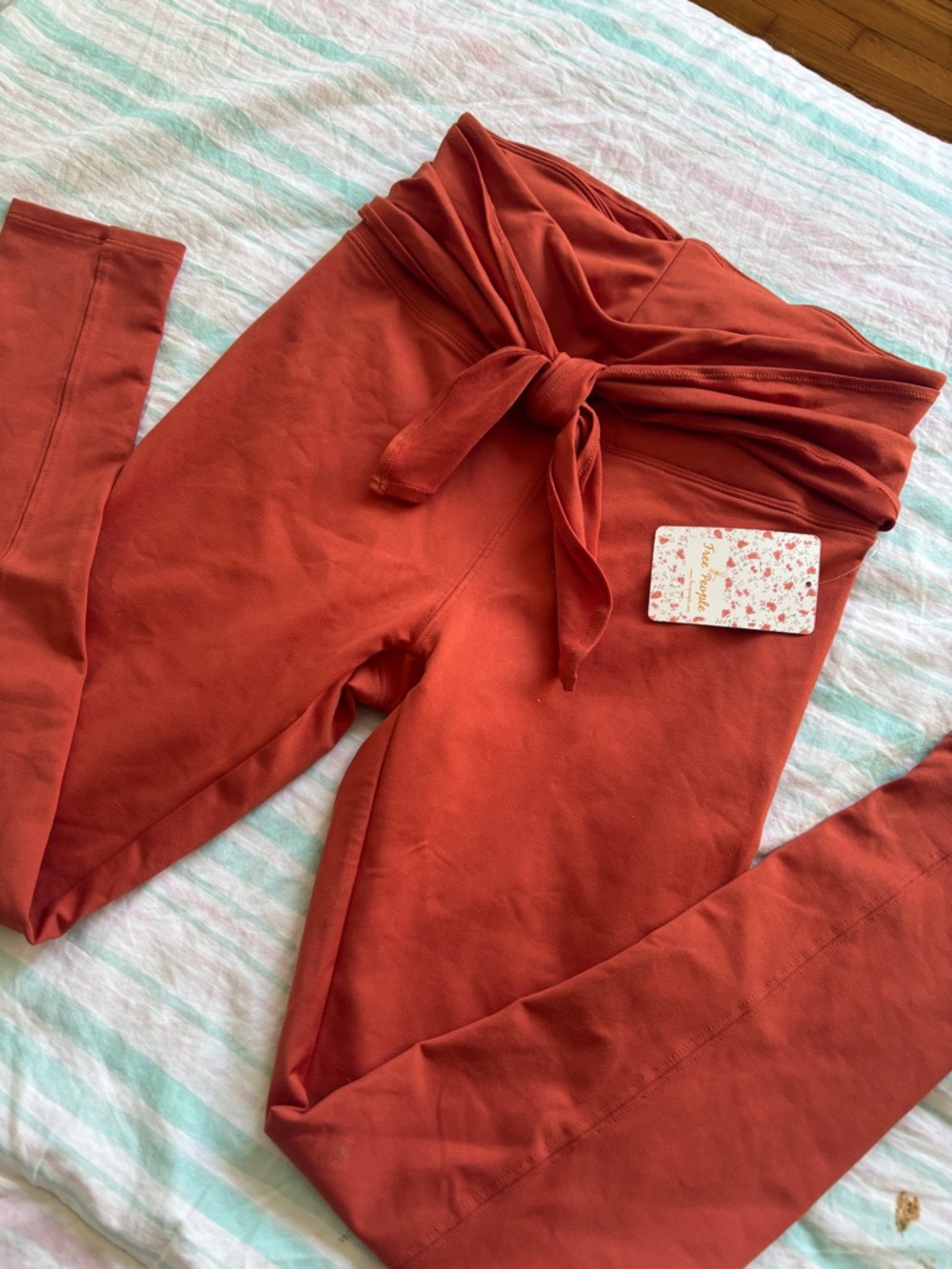 NWT Free people movement orange bow tie leggings S